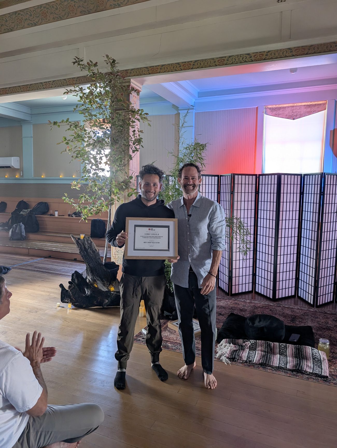 Sunny Binjola receiving his certification from John Wineland